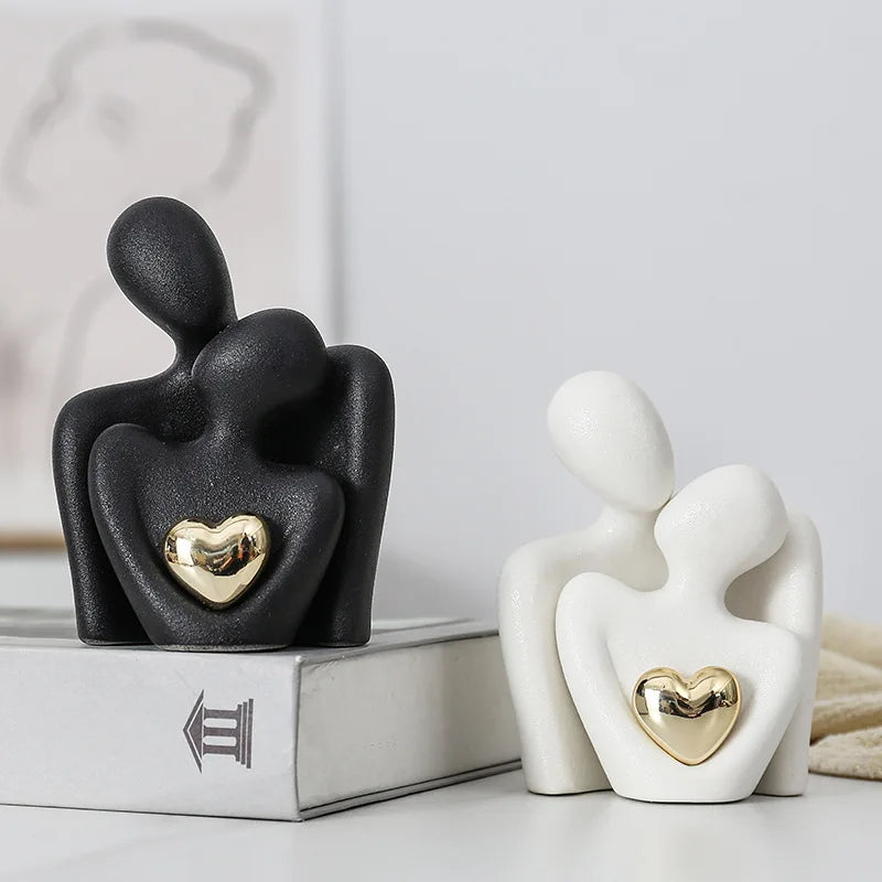 Abstract Loving Couple Sculptures With Golden Heart