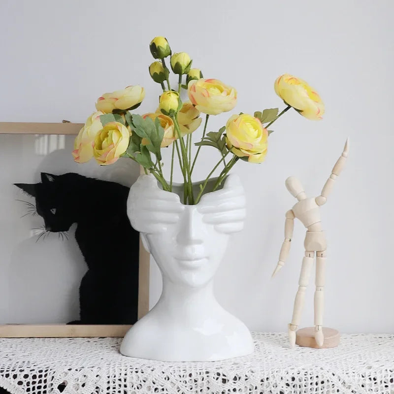 Abstract Face Ceramic Vase With Artificial Yellow Flowers