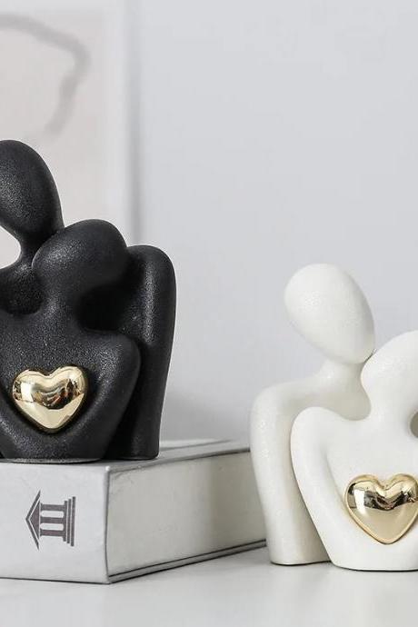 Abstract Loving Couple Sculptures With Golden Heart