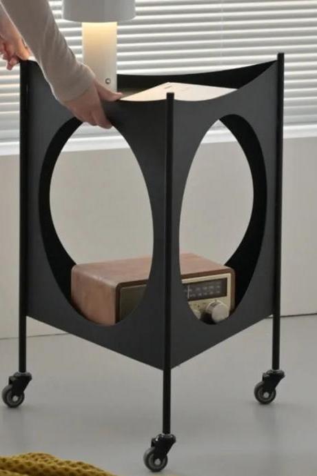 Modern Mobile Side Table With Circular Cutouts And Wheels